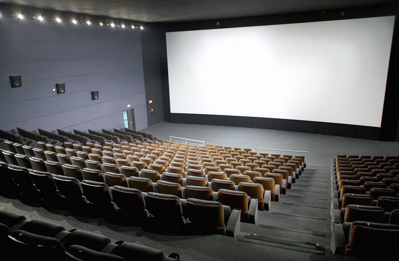Modern cinema interior with seats and screen